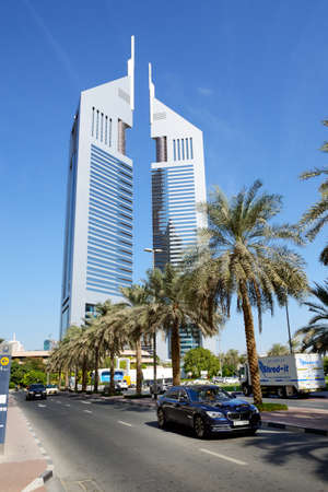 DUBAI, UAE - NOVEMBER 19: The Emirates Towers and BMW 7 series car on November 19, 2017. The Emirates Towers complex is set in over 570,000 m2のeditorial素材