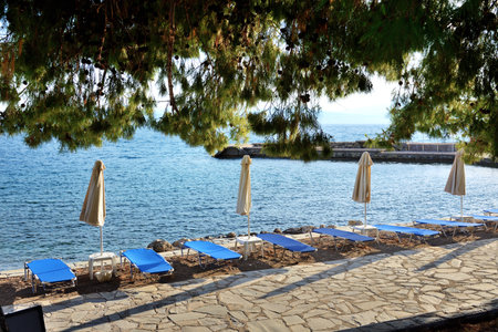 Sunbeds on the beach at luxury hotel, Peloponnes, Greeceの写真素材