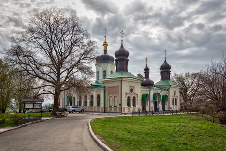 Orthodox Church of Kiev In the botanical garden crosses tend to heaven around trees blossomの写真素材