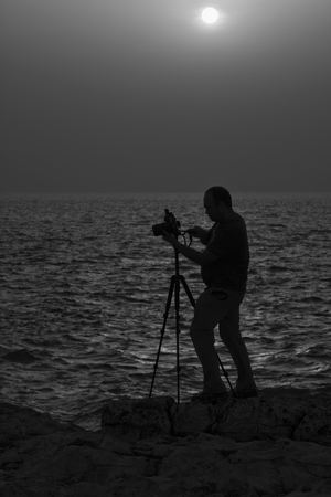 The photographer on mountainの写真素材