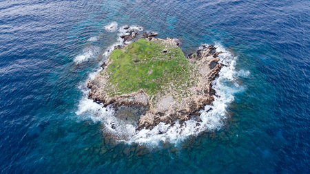 view of rough sea with rocks coastの写真素材