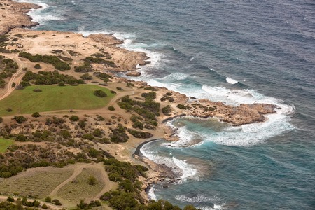 Mediterranean Sea waves breaking rocky coastline of Cyprus islandの写真素材