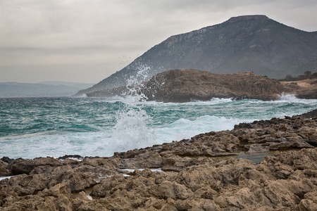 Mediterranean Sea waves breaking rocky coastline of Cyprus islandの写真素材