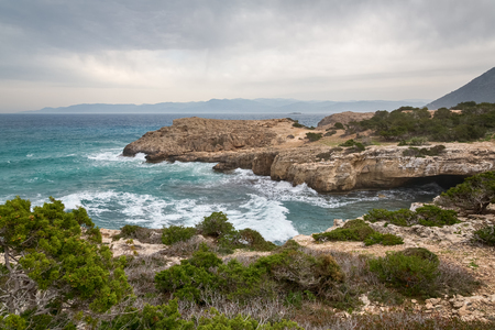 Mediterranean Sea waves breaking rocky coastline of Cyprus islandの写真素材
