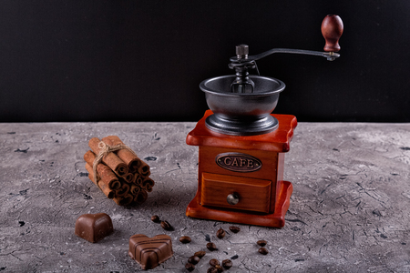 Coffee grinder and a cup of coffeeの写真素材