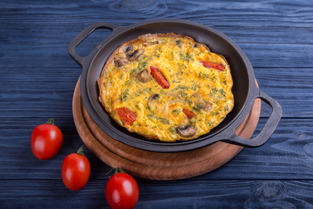 Omelette on an iron frying pan. Dish for the restaurantの写真素材