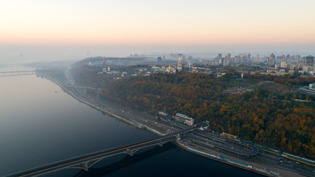 Skyline, Kiev city with beautiful morning sky. Pedestrian bridge. Left bank the Dnieper River.の写真素材