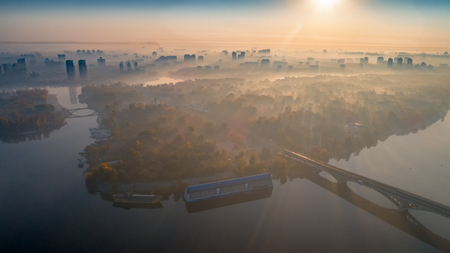 Skyline, Kiev city with beautiful morning sky. Pedestrian bridge. Left bank the Dnieper River.の写真素材
