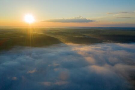 Canyon river in fog shooting from the airの写真素材