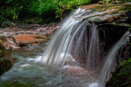 Mountain river waterfall landscape. Cascade of Dzhurynskyi waterfall.の写真素材