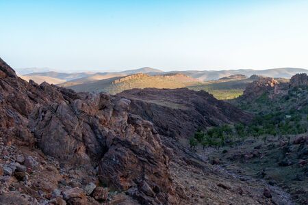 little caravan riding by desert between dune in Moroccoの写真素材