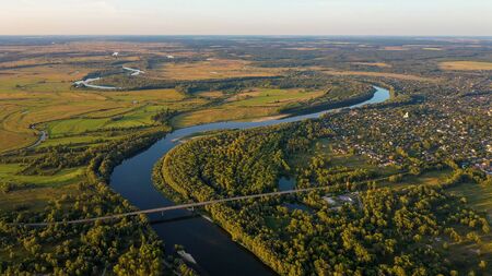 Aerial view of river flood. Beautiful flooded meadow. Flying above beautiful Desna river when the river is full of water at spring at National Nature Park in Chernihiv Oblast, Ukraine.の写真素材