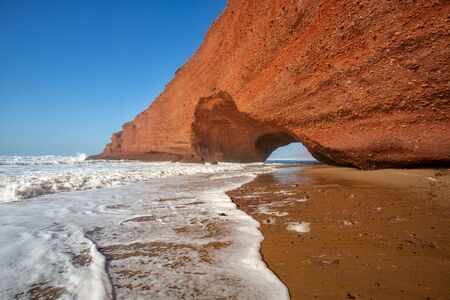 Red archs on atlantic ocean coast. Maroccoの写真素材