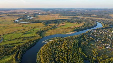 Aerial view of river flood. Beautiful flooded meadow. Flying above beautiful Desna river when the river is full of water at spring at National Nature Park in Chernihiv Oblast, Ukraine.の写真素材