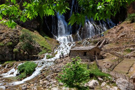 Kapuzbasi Waterfall in Aladaglar National Park Green trees round the waterfall soups composition.の写真素材