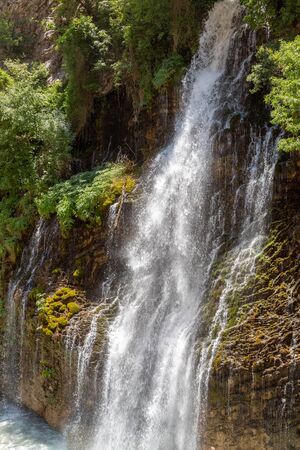 Kapuzbasi Waterfall in Aladaglar National Park Green trees round the waterfall soups composition.の写真素材