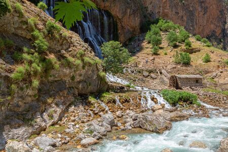 Kapuzbasi Waterfall in Aladaglar National Park Green trees round the waterfall soups composition.の写真素材