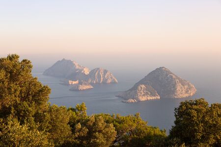 Picturesque Mediterranean seascape in Turkey. Dramatic sunrise in a small bay near the Tekirova village, District of Kemer, Antalya Province.の写真素材
