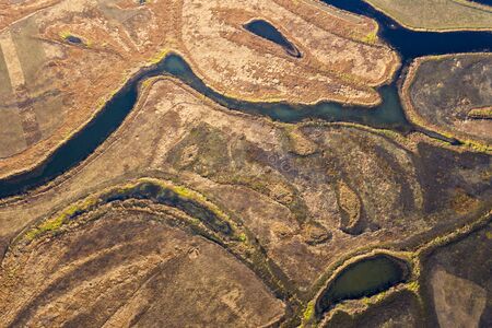 Aerial view of river flood. Beautiful flooded meadow.の写真素材