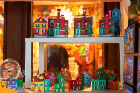 Venice landmark, Burano island canal, colorful houses church and boats, Italy.の写真素材