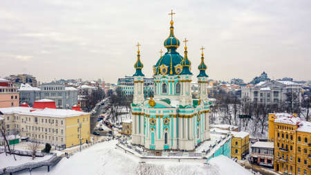 St. Andrews Church and Andriyivskyy Descent, in winter, Kyiv, Ukraineの写真素材