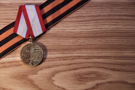 Medals of the Patriotic War in St. Georges Ribbon on a wood background. 9 mayの写真素材