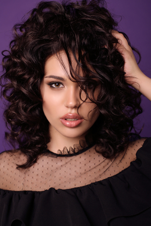 fashion interior photo of beautiful girl with dark hair in casual clothesの写真素材