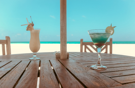Travel series. cocktail on table with eautiful landscape on Maldive islandsの写真素材