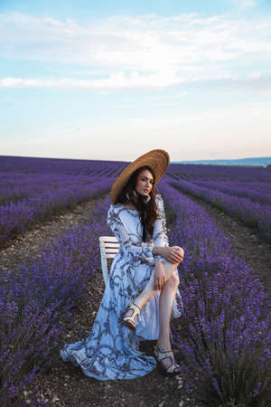 fashion studio photo of beautiful woman with dark hair in luxurious dress with jewelryの写真素材