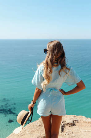 fashion outdoor photo of beautiful sexy woman with blond hair in elegant clothes and accessories...