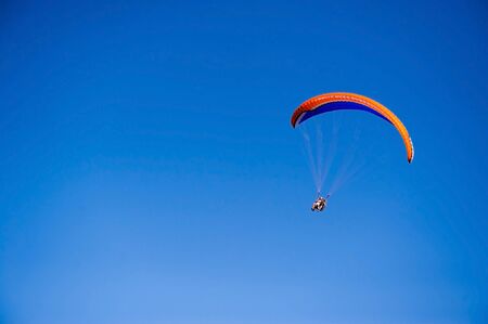 paraglider in the blue skyの写真素材