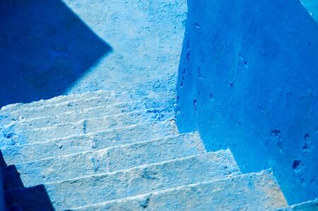 fragment of the old blue concrete staircase of the old spa town and the blue wallの写真素材