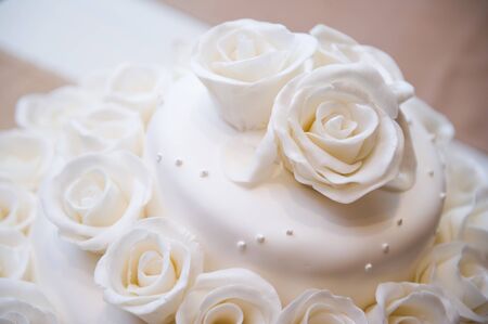 top of the cake, decorated with edible rosesの写真素材