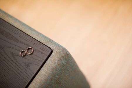 wedding rings on the armrest of the sofa copy spaceの写真素材