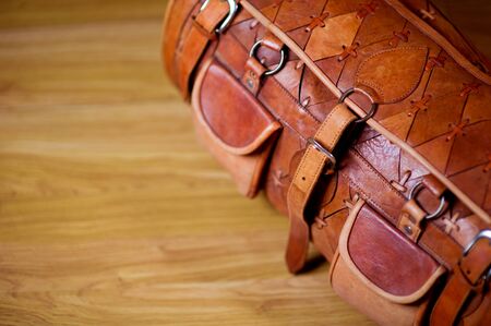 Photo of a travel bag that is standing on the floor in the corridor, top view. Copy spaceの写真素材