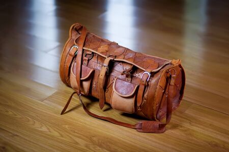 Photo of a travel bag that is standing on the floor in the corridor, top view. Tourism, travel conceptの写真素材
