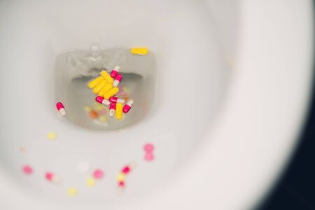 view on the pills thrown into the toilet but not washed awayの写真素材