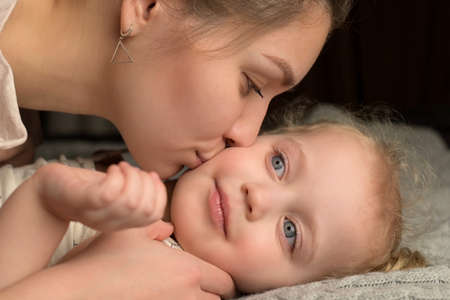 Showing love and affection from a mother to her childの写真素材