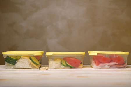three containers with a fresh healthy food on tableの写真素材