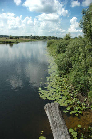 Ukraine, 2010, July, reflection of clouds, river and cloudsの写真素材