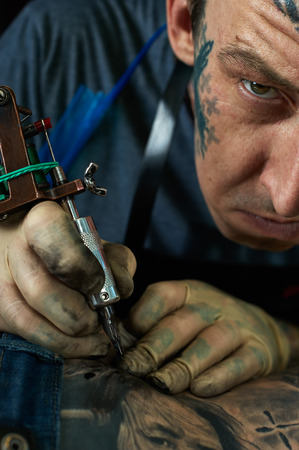 Closeup portrait of freaky tattoo artistの写真素材