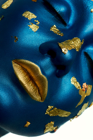 Blue beauty Face with Gold lips and closed Eyes.の写真素材