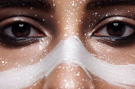 Fashion Woman with smoky Eyes and Paint on Faceの写真素材