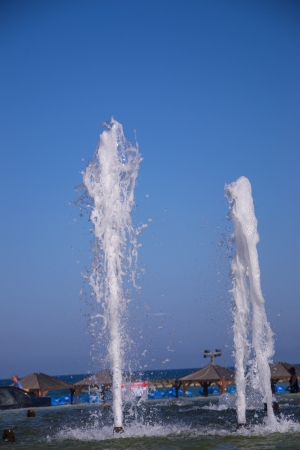 Splashes of fountain water in a fine dayの写真素材