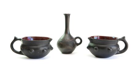 Two black decorative ceramic pots and small jug isolatedの写真素材