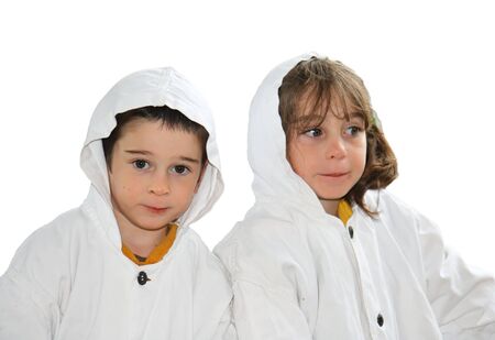 Cute preschool boy and girl in white hooded cloaks isolatedの写真素材