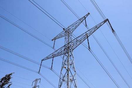 Steel support of overhead power transmission line on sky backgroundの写真素材