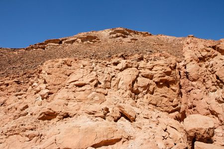 Red rocky hill in the desert landscapeの写真素材