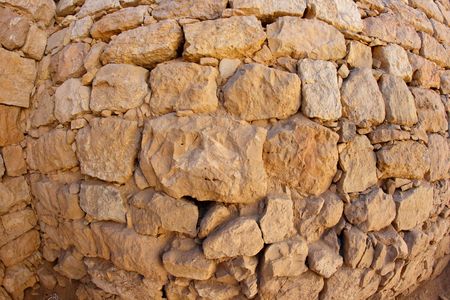 Convex ancient stone wall textureの写真素材