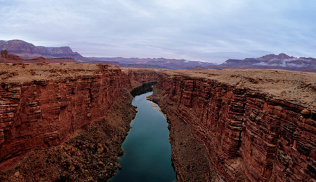 Panorama of green colored colorado river from Navajo bridge in overcast winter dayの写真素材